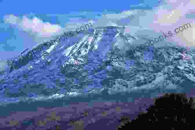 An Image Of The Snow Capped Mount Kilimanjaro, Symbolizing The Beauty And Brutality Of Nature In Snows Of Kilimanjaro