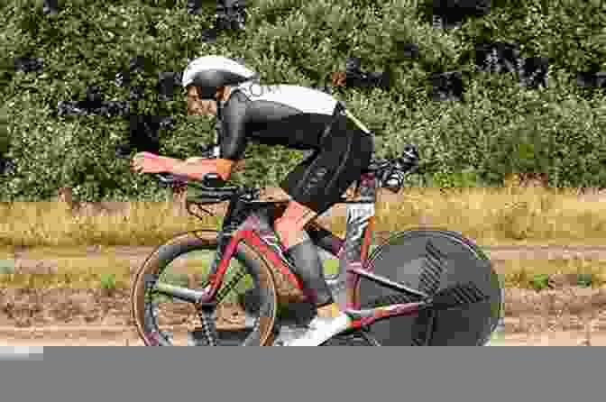 Triathlete Pushing Hard On A Bicycle During A Cycling Phase Of A Triathlon Modern Eventing With Phillip Dutton: The Complete Resource: Training Conditioning And Competing In All Three Phases